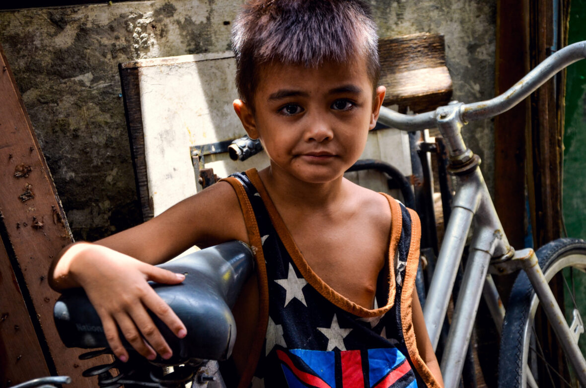 Young boy doing it tough in the Philippines