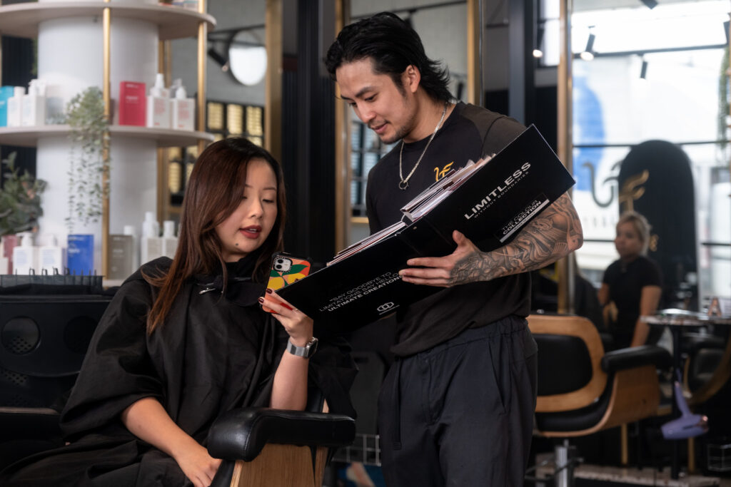 Hairdresser Rich Tran with client at Ultrafade salon